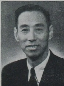 Photographic portrait of Wu Juenong in a suit and glasses, 1949.