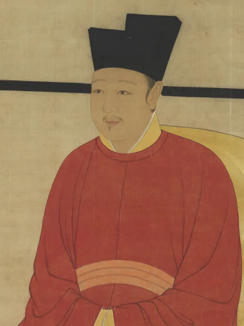 Hanging-scroll portrait of Emperor Huizong seated in red court robes and a black winged cap.