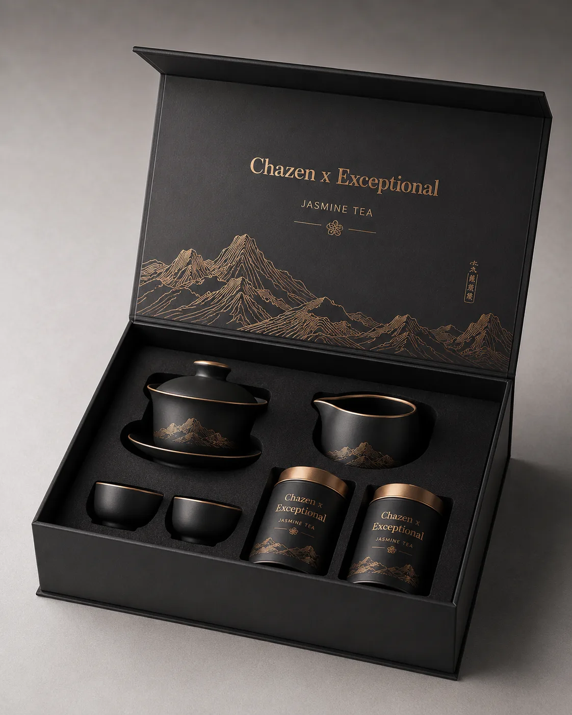 A black gift box containing dark teaware and tea canisters.